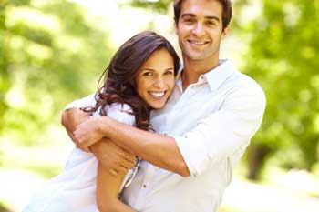 smiling-male-and-female-hugging
